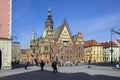 Wroclaw / POLAND - March 30, 2018: City hall with tower on main Wroclaw square, touristic season, sunny and blue sky Royalty Free Stock Photo