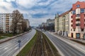 Long and wide Legnicka street with road and tram rails at cloudy sunny day seen from footbridge