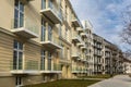 Lookup to facade of modern apartment building with big windows and balconies Royalty Free Stock Photo