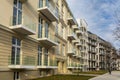 Lookup to facade of modern apartment building with big windows and balconies Royalty Free Stock Photo