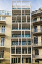 Lookup to facade of modern apartment building with big windows and balconies Royalty Free Stock Photo