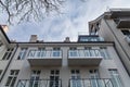 Lookup to facade of modern apartment building with big windows and balconies Royalty Free Stock Photo