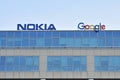 Nokia and Google sign on the wall of the office building. Royalty Free Stock Photo