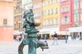 Dwarf is sitting on street water tap on Rynek Market Square Royalty Free Stock Photo