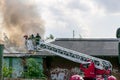 Firefighters, Fire brigade fighting fire in old abandoned building