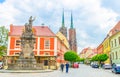 Wroclaw, Poland, May 7, 2019: Monument on square and cobblestone road street