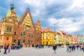Wroclaw, Poland, May 7, 2019: Old Town Hall building with clock tower spire, colorful buildings Royalty Free Stock Photo