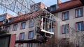 Men workers fitters mount Christmas decorations at a city fair. Preparation for celebrating New Year