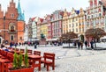 Wroclaw, Poland - October 17, 2015: People walking and resting on the famous, old market square in Wroclaw. Royalty Free Stock Photo