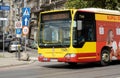 Wroclaw, Poland, red yellow bus on the street, vehicle closeup, public transport in the city. Transportation, commute simple