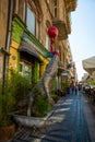 WROCLAW, POLAND: Sculpture of a crocodile with a ball. Beautiful building in the historic center of the old town