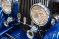 Frontlights and radiator of old Exclusive Luxury Rolls-Royce vintage car ckose-up. Royalty Free Stock Photo