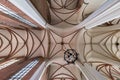 WROCLAW, POLAND - SEPTEMBER 2018: interior dome and looking up into a old defense catholic gotic church ceiling