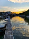 Long metal platform next to boats at afternoon