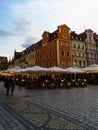 Old tenement houses at market square and beer gardens next to restaurants
