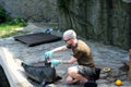 Wroclaw, Poland 08/24/2020. Zookeeper looking into the mouth of Phoca vitulina `Harbor Seal` as part of health test carried out