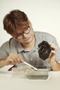 Wrong way cleaning sensor of digital camera by service man in water Royalty Free Stock Photo