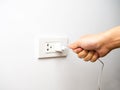 Wrong way pulling plug, unplug from socket by pulling wire Royalty Free Stock Photo