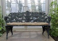 Wrought iron bench in garden