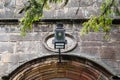 Wrought Iron decorative lantern seen at the entrance to an old, medieval building.