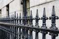 Wrought Iron Fence Along Limestone Building Royalty Free Stock Photo