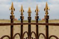 Wrought iron fence with decorative arrows