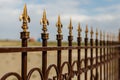 Wrought iron fence with decorative arrows