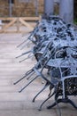 Iron furniture stacked up ready to be brought out for summer Royalty Free Stock Photo