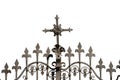 Wrought Iron Gate with a Religious Cross and Sharp Points Royalty Free Stock Photo