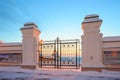 Wrought-iron gates, courtyard and fortress wall Royalty Free Stock Photo