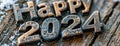 A wrought iron piece of metal that reads happy year 2024.