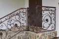 Wrought iron railings on the stairs,modern metal wrought iron railing entrance to the house Royalty Free Stock Photo