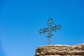 Wrought Iron Religious Cross above a Rock Karst Formation - Lessinia Plateau Italy Royalty Free Stock Photo