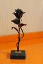 Wrought iron rose on the table