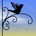Wrought iron silhouette bird, sunrise sky Royalty Free Stock Photo