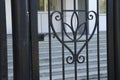 Wrought iron tracery black fence fragment