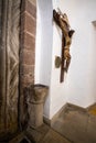 Wrought iron wooden doors to an old 12th-century church and a wooden crucifix, Poland