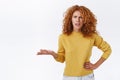 Wtf, what the hell. Pissed, outrated furious redhead curly girlfriend being offended or annoyed, fed up hearing nonsense Royalty Free Stock Photo