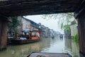 WUZHEN,CHINA-MARCH 6,2012: The movement of boats on one of the canals of the city of Wudzen