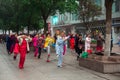 People performing exercise in the morning at the city