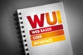 WUI - Web Based User Interface acronym on notepad, technology concept background