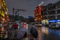 People walking in rain in Wulingyuan town at night Royalty Free Stock Photo