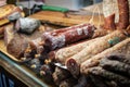 Wurst, sausage and meat in shopping display at butcher -