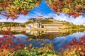 Wurzburg. Main river waterfront and scenic Wurzburg castle and vineyards reflection view through autumn leaves