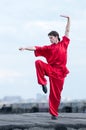 Wushoo man in red practice martial art