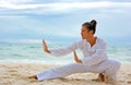 Wushu man on the beach Royalty Free Stock Photo