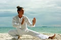 Wushu man on the beach Royalty Free Stock Photo