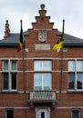 Wuustwezel, Antwerp Province, Belgium - Facade of the town hall and Flemish flag