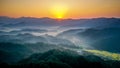 Landscape of mountains covered in greenery during the sunrise in Wuyuan, China