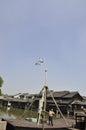 Wuzhen, 4th may: Acrobatics on flexible bar from the Historic museum Town Wuzhen Dongzha